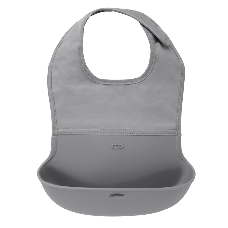 OXO Tot Roll-Up Bib in grey with silicone pocket