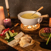 Boska Candle Light Fondue Twinkle, white fondue pot with lit tealights, table setting
