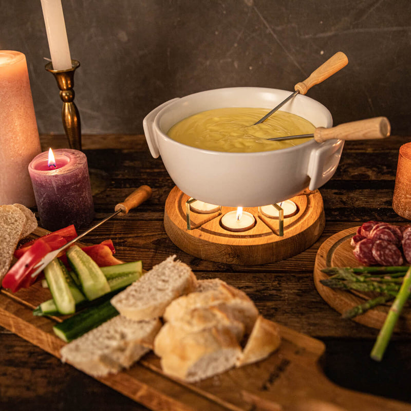 Boska Candle Light Fondue Twinkle, white fondue pot with lit tealights, table setting