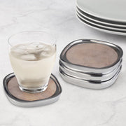 Nambé Sandstone Coasters (Set of 4) in a display setting; other items shown are sold separately.