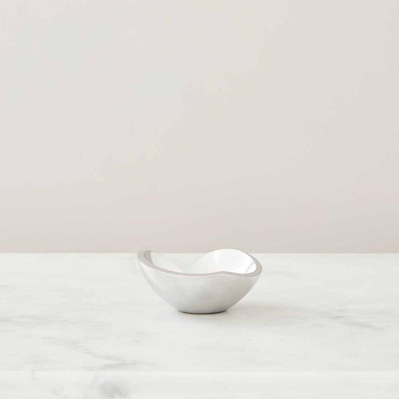 Nambé Love Mini Heart Bowl in a display setting; other items shown are sold separately.