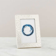 Nambé Dazzle Photo Frame in a display setting; other items shown are sold separately.