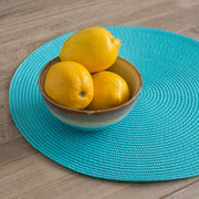 Now Designs Disko placemat in turquoise - lifestyle