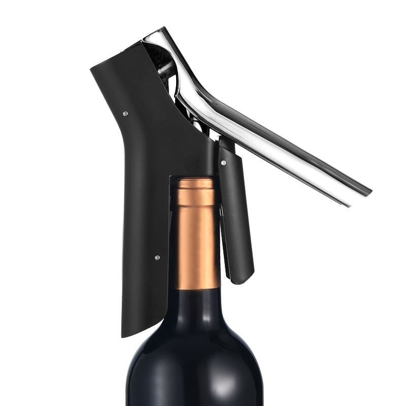 Natural Living - Opera - Vertical Lever Corkscrew — lever corkscrew attached to a wine bottle.