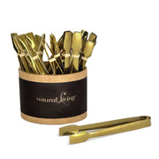 Natural Living - Small Serving Tongs - Gold (24-Pack) — countertop display of 24 gold tongs.