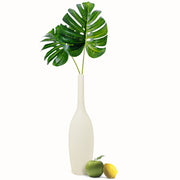 Natural Living - Textured Bud Vase - Cream — vase with a single leafy stem.