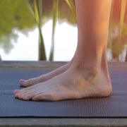 LOVASKIN foot care lifestyle – bare feet on a yoga mat