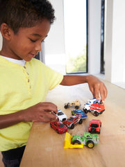 Matchbox - Die-Cast Cars & Trucks (9-Pack, Single Random Pick) — Lifestyle example: child playing with vehicles