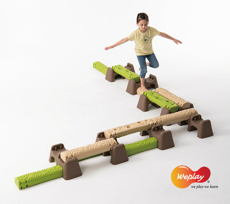 Weplay Jungle Trial, child walking on a narrow raised log route